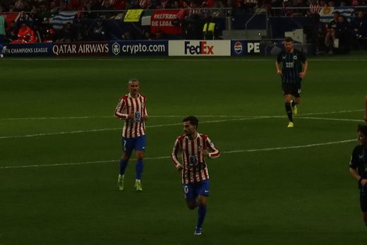 Two Atlético players jog back into position during the Champions League match
